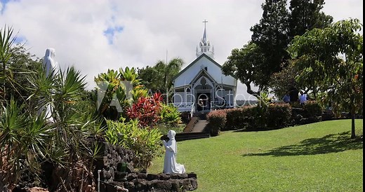 Painted Church tropical garden Kona Hawaii. Big Island. Overlooking beautiful and historic Kealakekua Bay, St. Benedict's Painted Church. Built 1842 with beautiful murals of biblical scenes.