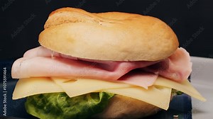 Bagel sandwich brunch, lunch plate of a bagel with smoked salmon and cream cheese and ham, close up morning cafe menu.