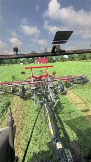 Gently tedding alfalfa for leaf retention