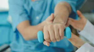 Download Physiotherapist instructing the patient during exercise for free