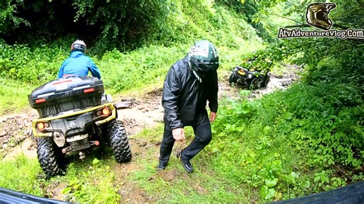 ATV riders battle tough downhill stream crossing