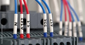 Terminal blocks in electrical cabinet. Industrial electrical equipment and wiring. Terminal blocks for electrical connection, electrical panel at a assembly with number tag equipment