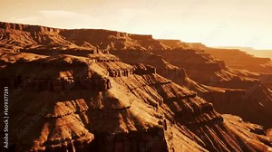 Stylized cinematic animation of the Grand Canyon with layered cliffs and vast desert terrain The camera glides parallel to the edge capturing epic views, sunlight