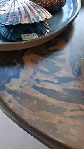 New copper beauties in the window. A beautifully crafted table with solid brass clawfoot feet ,vintage copper in all its pattern petina glory. An interesting asset to your living space. ....and for the garden or sunroom a copper wishing well/bird bath bowl. By Tony Barnett. Also featured is Claire Bryers pottery bowl and copper shells by Otto. | Monique Rush - Whitianga Art Gallery