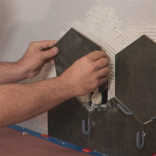 Crafting perfection around every corner, even outlets! Ensuring every tile fits securely for a job well done. 💪🔨 https://bit.ly/3HzsaR5 #HomeImprovement #tiling #tileinstallation | Marshalltown Company