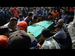 Fainting and tears at funeral of Indonesia jet crash passenger