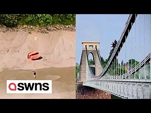 Two base jumpers seen jumping off one of Britain's most iconic bridges | SWNS