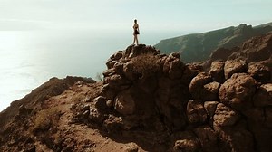 Woman Stands On Rocky Outcrop Overlooking Stock Footage Video (100% Royalty-free) 3500178669 | Shutterstock