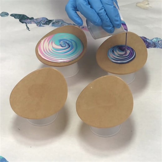 Here's an acrylic pour on some clear acrylic egg-shaped coasters from Artist Till Death. I used Mixed Media Girl Pouring Paints for the pour and Mixed Media Girl Artist Resin to seal them. | Mixed Media Girl