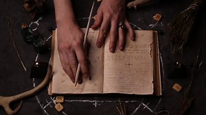 Black magic candles burn. Smoke on the background of the magical attributes of black art. Halloween concept.