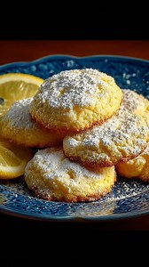 Lemon Gooey Butter Cookies with a soft, gooey center and lightly crackled edges, made with real butter, cream cheese, and fresh lemon zest. The dough comes together smoothly, chills briefly for perfect structure, then bakes into cookies that stay tender inside while setting just right on the outside. A delicate balance of sweetness and citrus makes these cookies rich without being heavy. Simple ingredients, precise steps, and a reliable result every time. | Swift Tasty