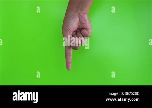 Asian hand showing index finger gesture on green background. hand gesture pointing at something Stock Video Footage - Alamy