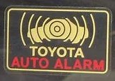 Alarm system sticker on driver's window-...