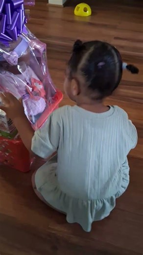 ITS NOT EASTER YET LOLL MY GRANDAUGHTER KJ TRYING HER BEST TO OPEN HER BASKET I MADE #easterbasket