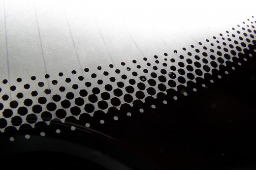 The Real Reason Your Car Windshield Has Those Small Black Dots