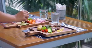 A Waitress Sets the Table in a Restaurant