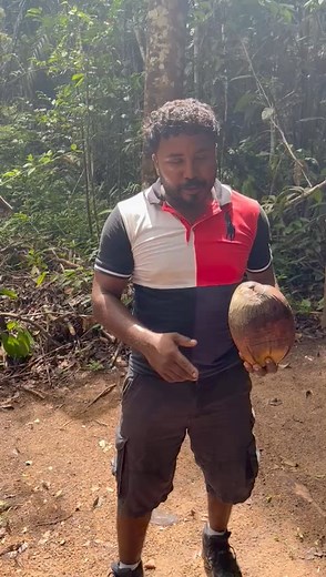 Peeling coconuts the Indigenous way in Moraikobai Village. #VisitGuyana | Visit Guyana