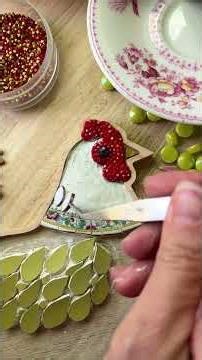 Making a mosaic chicken with vintage china, tiles, rhinestones and glass.