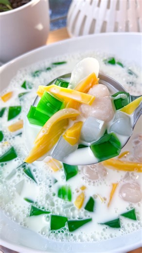 Phuong Le #theasiantestkitchen on Instagram: "Chè Thái Serves 12 Ingredients • 1 can lychee in syrup • 1 can jackfruit in syrup • 1 jar palm’s seed slices (attap seeds) • 1 jar coconut gel (nata de coco) • Green jelly, cut into cubes • 1–2 cups cold half-and-half • Ice (optional) Tip: Chill all cans and jars ahead of time so the dessert can be served immediately. Instructions 1. Prepare the fruit & jellies • Pour the entire can of lychee (lychee + syrup) into a large serving bowl. • Keep the lyc