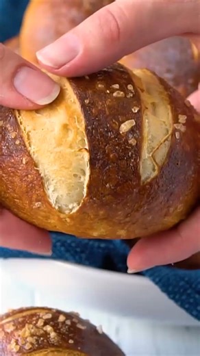 It's easy to make bakery-quality pretzel rolls with that perfect salty, chewy brown crust. Perfect for use as a dinner roll or for sandwiches, sliders, or burgers. https://thestayathomechef.com/homemade-pretzel-rolls/ | The Stay At Home Chef