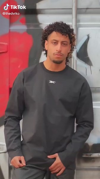 Dynamic Urban Acrobatics: Young Male Performer's Skills