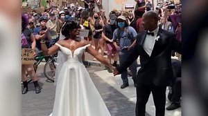 Protests passed wedding venue. Bride and groom joined them | CNN