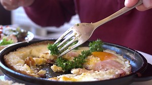 Download Man Eating Traditional Breakfast With Fried Eggs, Toast and Salad for free