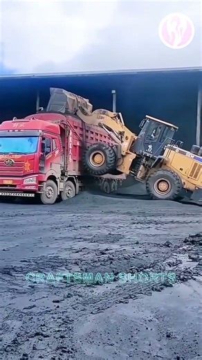 Bulldozer | Bulldozer loading coal onto truck