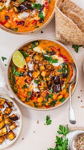 Amy Lanza | Vegan Food & Recipes ✨ on Instagram: "Golden Chickpea Dahl with Roasted Aubergine 🍆✨ Creamy thick and delicious lentil dahl with sweet potato chunks, spinach and chickpeas topped with delicious tender roasted aubergine and mopped up with flatbreads . 🍆comment “dahl” and Amy will DM you the recipe🍆 . There are a few things that make this dahl NEXT LEVEL delicious. It has chickpeas as well as the lentils for added plant-based protein and fibre and it has peanut butter in the sauce t