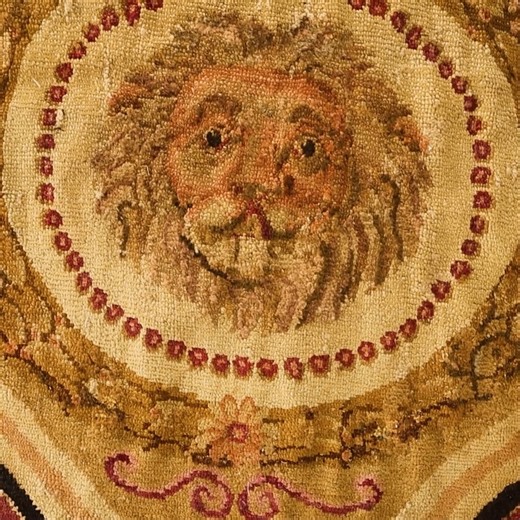 Doris Leslie Blau on Instagram: "💎A rare gem of English craftsmanship. This early 19th-century Axminster carpet captivates with its rare circular form and mythological grace. A golden leaf roundel frames four stylized fish encircling a naturalistic lion’s head — a symbol of strength and artistry — all surrounded by a finely drawn border of griffins, palmettes, and scrolling vines. Its sand and gold palette, enriched with plum and rose tones, reflects the timeless sophistication of English neocl