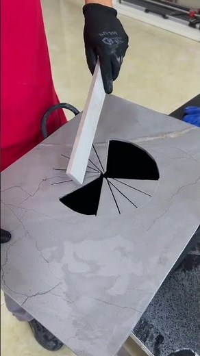 Circular tile cut using a manual tile cutter.