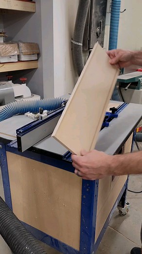 I'll never go back to my old method of trimming off edge banding. I have no idea why it took me so long to use the router table with a sharp cutter, but this is my go to now! I lift the fence high enough off the table so that the excess edge banding runs under it and I'm using a downcut bit from @freudtools so that edge banding is being "pushed" up to the plywood rather that being "pulled" away from it during the cut. There's still a little clean up to do, but nothing a little sanding won't knoc