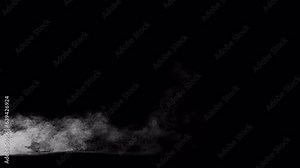 Video of low mist, steam, fog blowing into and through the frame, 4k 24p with alpha channel for transparent background. The mist glides across the ground plane