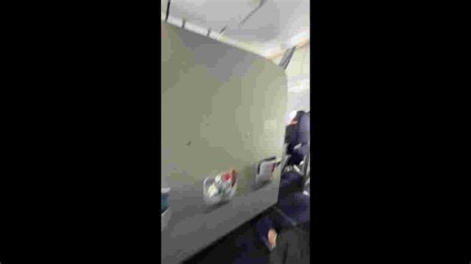 Plane passenger sticks her smelly feet through seat gap in front