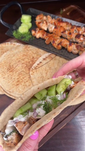 Easy homemade chicken gyros made with grilled marinated chicken, tzatziki sauce, fresh cucumber, and pita bread. A quick Greek-inspired dinner everyone loves! #quickdinner #easyrecipe #homecooking #gyros #weeknightdinner Chicken gyro Ingredients: - 2 large chicken breasts - Tzatziki sauce - 1 Cucumber - 1 red onion - 1 bunch of dill - 1 package of peta bread - 1 lemon - 1 tbs garlic powder - 1 tbs paprika - Salt and pepper to taste - Grill skewers Directions: 1. Cube chicken 2. Season generously