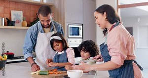 Cooking, food and parents with children in the kitchen bonding and having fun together at home. Happy, smile and young mom and dad teaching and preparing a meal for dinner, supper or lunch with kids.