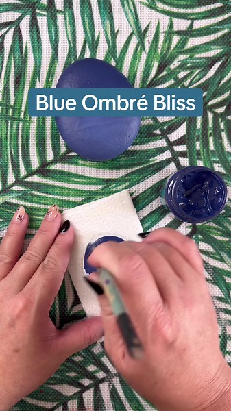I’m feeling these shades denim blue and white to create a soft pretty ombré effect. I’ve only used two shades, a denim blue and white, in basically 3 steps: 1. Only blue at the top half of the rock - do not let this dry then move onto the next step: 2. Using the same brush, wipe off the excess blue paint and go in with white at the bottom of the rock and bring this up to meet the original blue layer - swipe your brush back and forth to blend this out - do not let this dry before moving to the ne