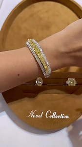 Carrying sunshine on your hand with Novel Collection - Fancy Color Diamonds ! A brilliant display of fancy yellow diamonds in a graduating form in this stunning bracelet, creating contrast by iced out white diamond setting, paired with a 15-carat fancy yellow cushion-cut diamond and eternity band for #MyLoveAffairWithDiamonds! #MyLoveAffairWithDiamonds #YellowLovin #YellowDiamond #Brilliance #Scintillation #Sparkle #Fire #EngagementRing #CushionCrush #CushionCut #EternityBand #Bracelet #HighJewe