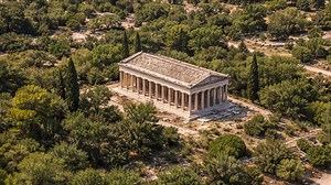 Ancient columns standing quietly among the trees