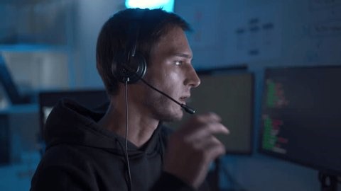 clip-4026794149-software-developer-support-staff-wearing-headset-while