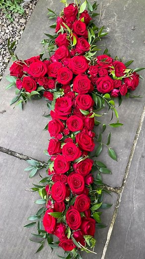 A Cross of Deepest Love There’s something incredibly powerful about a simple cross filled with roses. In this time-lapse reel, you’ll see our florist create a beautiful funeral tribute using classic Red Naomi roses and dainty red spray roses, arranged on a base of ruscus and ivy. This design is full of symbolism — the cross representing faith and peace, and the red roses standing for love, honour, and remembrance. Each bloom is placed with care and intention, creating a fitting farewell for some