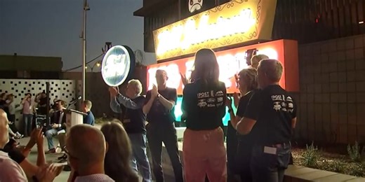 Downtown Mesa glowing bright with restored vintage neon lights