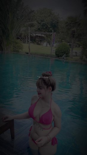 Woman in Pink Bikini by the Pool - Captivating Summer Vibe