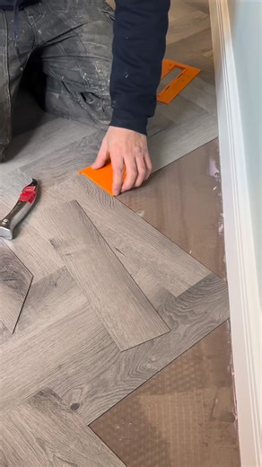Getting those final bits in on the Herringbone LVT floor, made easy by the Myscribe Solutions Ltd template board. #willowtreeflooring #trade #flooring #parquet #PrecisionTools #flooringinstaller | Willow Tree Flooring
