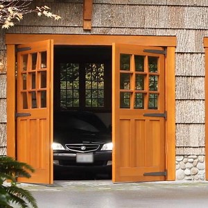 No better way to make an entrance than with our Franklin Automatic Outswing Opener! | Real Carriage Doors | Facebook