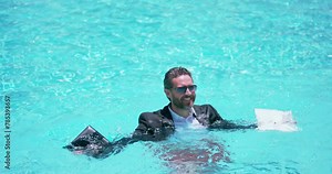 Crazy summer business. Crazy freelancer in swimming pool. Crazy business man in wet suit in swimming pool. business vacation. Funny crazy businessman formal wear in swim pool. Hot summer business. Stock Video