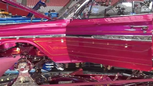 LOWRIDERS 🔵 on Instagram: "The lowrider car show feels like a rolling art gallery, where every vehicle is a masterpiece of passion and pride. Sunlight reflects off flawless candy paint, metallic flakes, and deep glossy finishes that look like liquid glass. Chrome bumpers and wire wheels sparkle, while whitewalls sit perfectly tucked under smooth, lowered frames. Each car tells a story through its details, from hand-stitched interiors and velvet headliners to custom murals and pinstriping that h