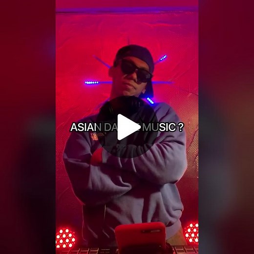 Vibrant DJ Performance in Colorful Atmosphere