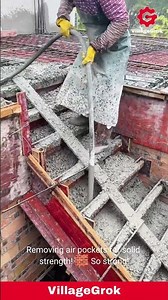 Concrete Pouring with Vibrator: Construction Worker Ensures Solid Foundation