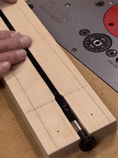 Routing the Truss Rod Channel I use a V bit on my router table to line up the center of the cutter with the center line on the neck blank. I move the fence over till I get this lined up dead center. My truss rod is a spoke wheel type and I’ll have to use to different bits to make it fit. I’ll use the ¼” bit for the full length of the rod, and a 3/8” bit for the spoke end. With the 3/8” bit I can set up a stop block for the cut. #guitars #luthier #guitarbuilder #woodworking #electricguitar